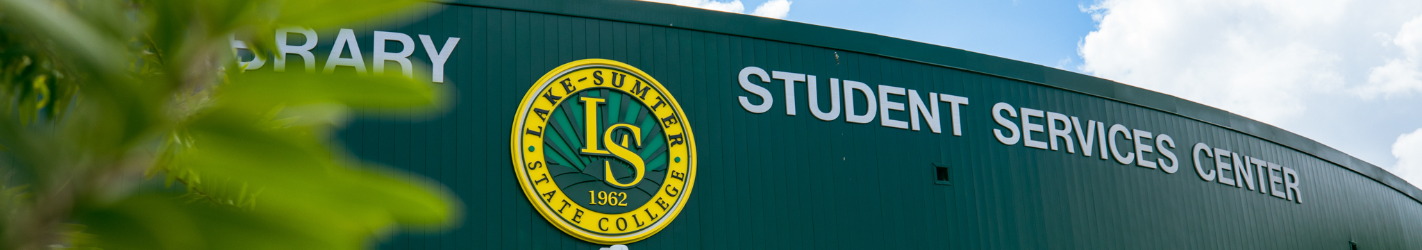 LSSC college seal on a building with the word Student Services Center next to it